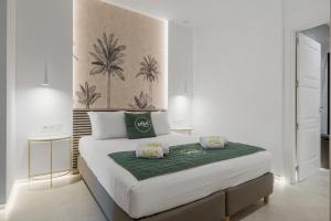 a bedroom with a large bed with a green blanket at Algaidamar - Dos in Mijas Costa