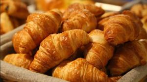 a pile of croissants sitting on a plate at Hotel Mare Blu in Pineto