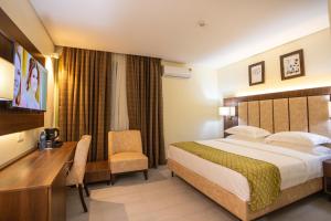 Krevet ili kreveti u jedinici u okviru objekta Jogor Hotel Ibadan