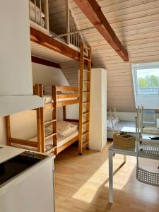 a kitchen with bunk beds in a room at Nørager Apartments in Nørager