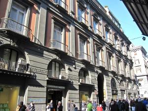 a group of people walking in front of a building at Toledo in Naples