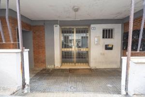 an entrance to a building with a glass door at Cavour Home in Porto Torres