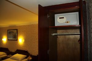 a hotel room with a door with a clock on it at Hotel Akyildiz in Istanbul