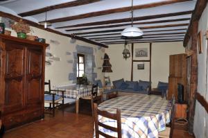 a room with a table and chairs and a dining room at Etxeberri Landa Etxea in Errezil