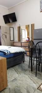 Posteľ alebo postele v izbe v ubytovaní Whitehouse Lodge Benoni