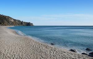 a view of a beach with the ocean at Pet Friendly Apartment in Isca sullo Ionio
