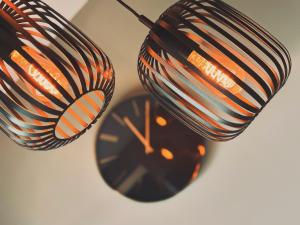 two clocks sitting next to each other on a table at Residence Pranterhof in Marlengo