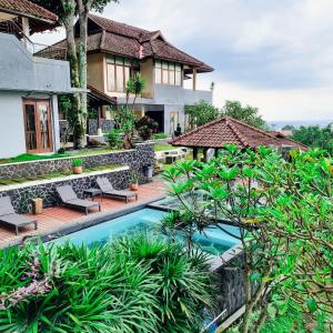 an image of a house with a swimming pool at Dago Highland Resort in Bandung