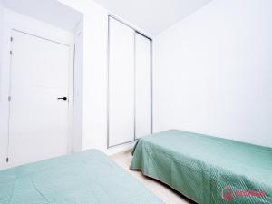 Postel nebo postele na pokoji v ubytování La Elegancia