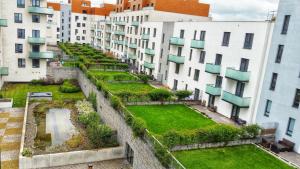 an apartment garden in the middle of buildings at Apartment in the Heart of Ostrava in Moravská Ostrava