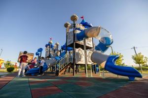 a slide at a playground with people on it at Kompleks Milosevic in Bijeljina