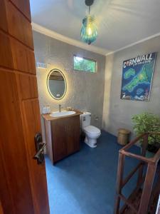 a bathroom with a toilet and a sink at Amba Kola Udawalawa in Udawalawe