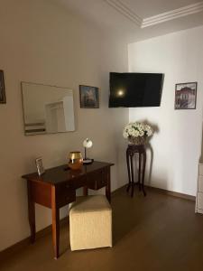TV a/nebo společenská místnost v ubytování La Corte del Castello