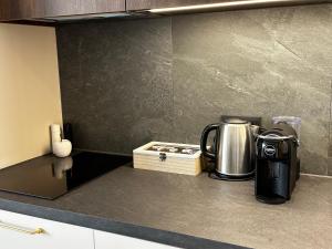 a coffee maker on a counter in a kitchen at A&I city view apartment in Vilnius