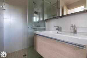 a bathroom with a sink and a shower at Goulapie, Village de gîtes in Saint-Quentin-sur-Sauxillanges +104 photos