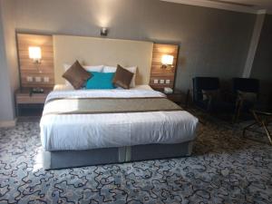 Voodi või voodid majutusasutuse فوربوينتس الشهباء Four points Alshahba toas