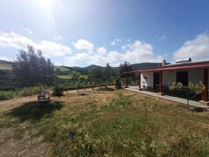 a view of a house with a yard at Da Nonno Francesco in Teulada