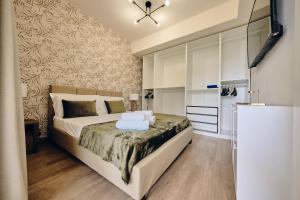 Krevet ili kreveti u jedinici u objektu CORTILIO Luxury Homes on Etna