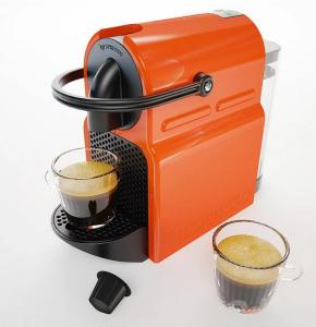 an orange coffee maker with a cup of coffee at Lovely plage - St François - Mer in Le Havre