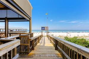 a boardwalk leading to the beach at a beach resort at Lake Town Wharf in Panama City Beach