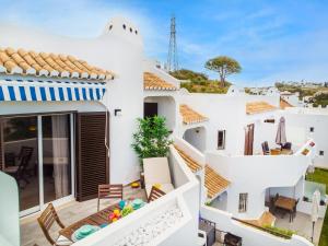 a villa with a view of the garden at Clube Albufeira: 2BR Prime Holidays Retreat in Albufeira