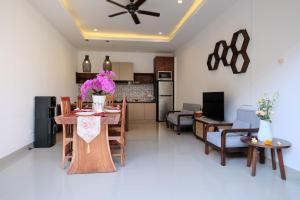 a kitchen and living room with a table and chairs at Villa Julia in Sanur