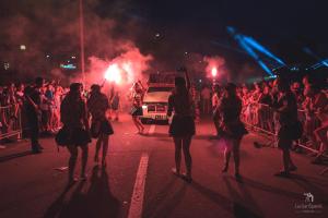 a group of people walking down a street with flares at Apartment Ana in Senj