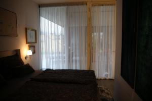 Posteľ alebo postele v izbe v ubytovaní Apartment SunBox