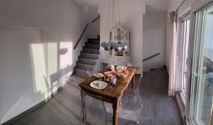 a kitchen with a table with food on it at Einzigartiges Haus mit wunderbaren Seeblick auf Lago Maggiore in Massino Visconti +25 photos