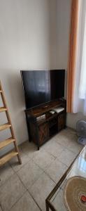 a living room with a large flat screen tv at Appartement Cosy Centre Nice in Nice