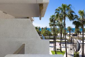 a view from the balcony of a house with palm trees at Acacias Apartamentos Salou in Salou