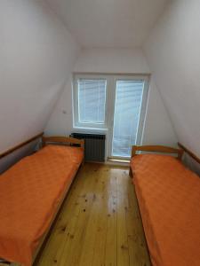 Postel nebo postele na pokoji v ubytování Vila Nina i Lux apartman