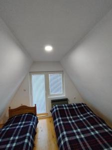 Postel nebo postele na pokoji v ubytování Vila Nina i Lux apartman