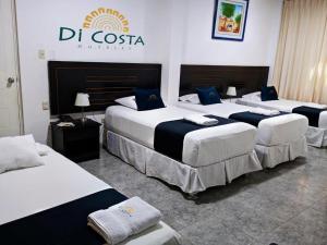 Cama o camas de una habitación en Di Costa Hoteles