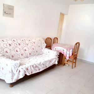 a living room with a couch and a table at 2 bedrooms house at Ciudad Real in Ciudad Real