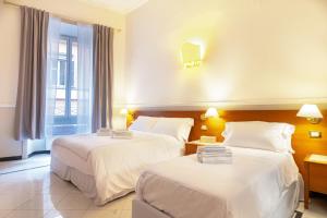 Katil atau katil-katil dalam bilik di Hotel Domus Rome
