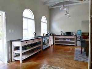 a kitchen with a counter and a counter top at Shingalana Cottages in White River