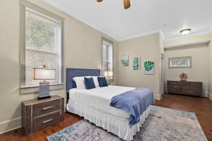 a bedroom with a large bed and a window at The Ray- 1st Floor Charming Condo- Walk to Downtown in St. Augustine