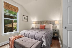a bedroom with a large bed and a window at Casa DeSoto - Luxury Downtown Oasis in Saint Augustine