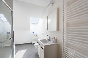 Koupelna v ubytování Libero Apartments + 37 fotografií