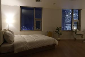 Katil atau katil-katil dalam bilik di "GRAND OPENED" Maxtyle Guesthouse Dongdaemun