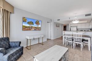 a living room with a couch and a table at Carolinian Resort 2032 in Myrtle Beach +19 photos