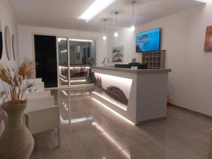 a room with a counter with a vase on the floor at Blue Marine - Free Parking in Tropea