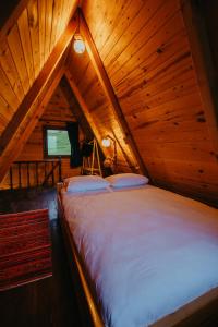 Postel nebo postele na pokoji v ubytování Yerumoni bungalov