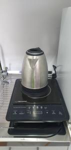 a toaster sitting on top of a stove at Cozzy apartment near the Aiport Podgorica in Mitrovići