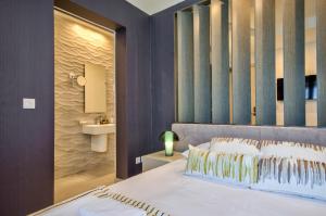 Voodi või voodid majutusasutuse Jules Suites toas