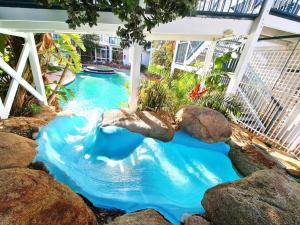 a water slide in a pool with rocks at West Beach Lagoon 107 - Great Value in Perth