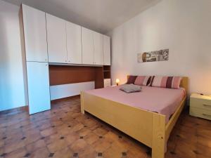 Llit o llits en una habitació de Le Case Bianche di Castelsardo