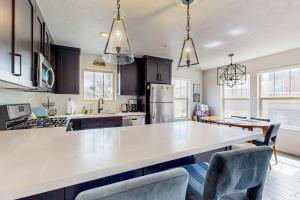 a kitchen with a white counter top in a room at Shimmering Slopes in Heber City