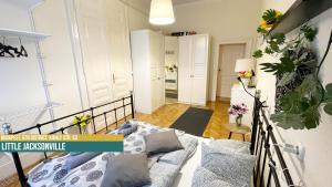 Posteľ alebo postele v izbe v ubytovaní Little Americas Music Academy Apartments